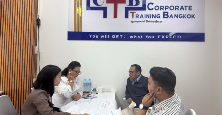 Professionals in a workshop discussion at Corporate Training Bangkok